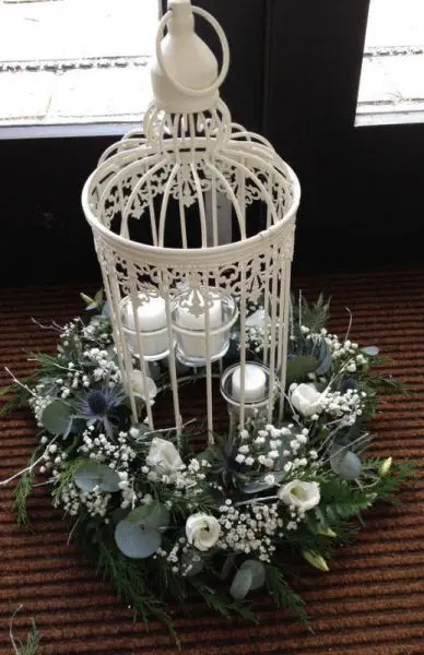 Winter Wedding Eryngium and White Flowers Birdcage Table Arrangment