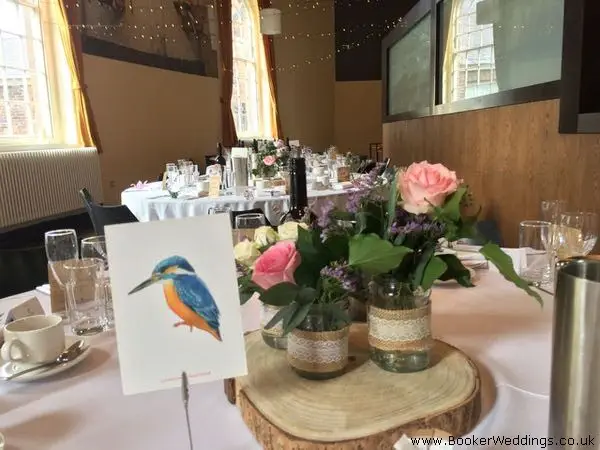 Table Arrangements Flowers in Jars on Logs