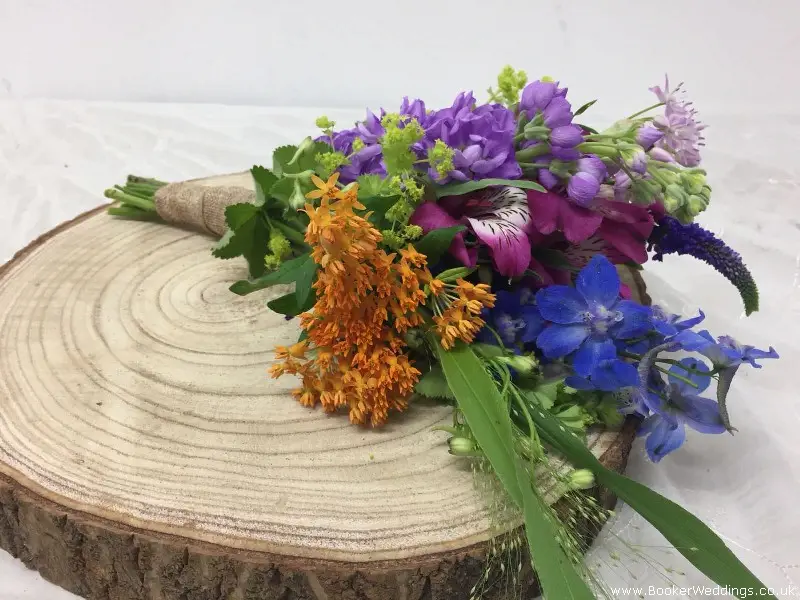 Small Flower Girl Handtied of Bright Summer Flowers Including Delphinium Stocks and  Allium