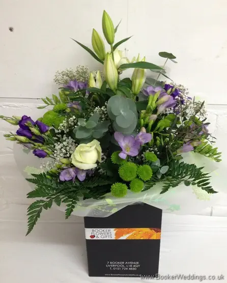 Purple and cream wedding flower Thank You Bouquet with ivory avalanche roses, purple lissianthus, lilac freesia and gypsophila