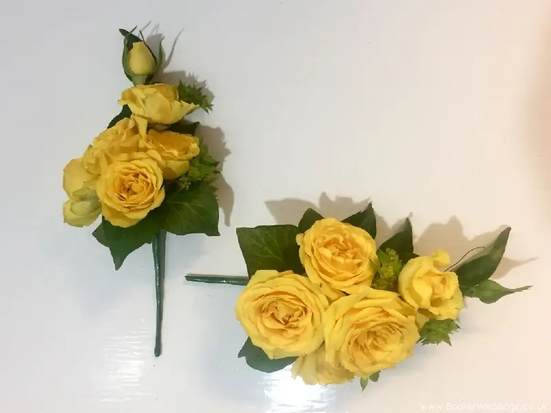 Yellow spray roses and burpurleum bridal party pin corsages