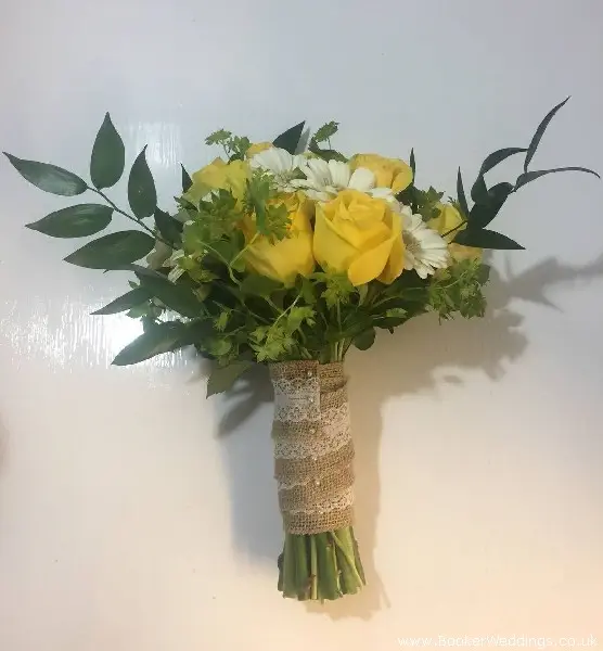 Yellow and white bride handtied bouquet with roses gerbera and burpurleum