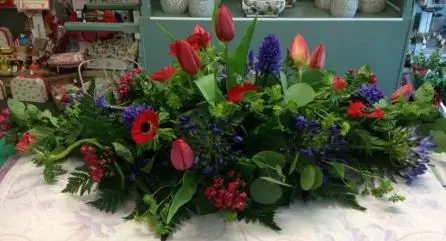 Red and Blue Tulip Agapantha Bouvardia and Hyacinth and Anenome  Top Table Arrangement Front  - Meaning of Flowers