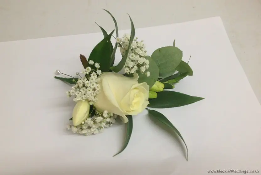 All white wedding flowers with spray roses and gypsophila grooms buttonhole