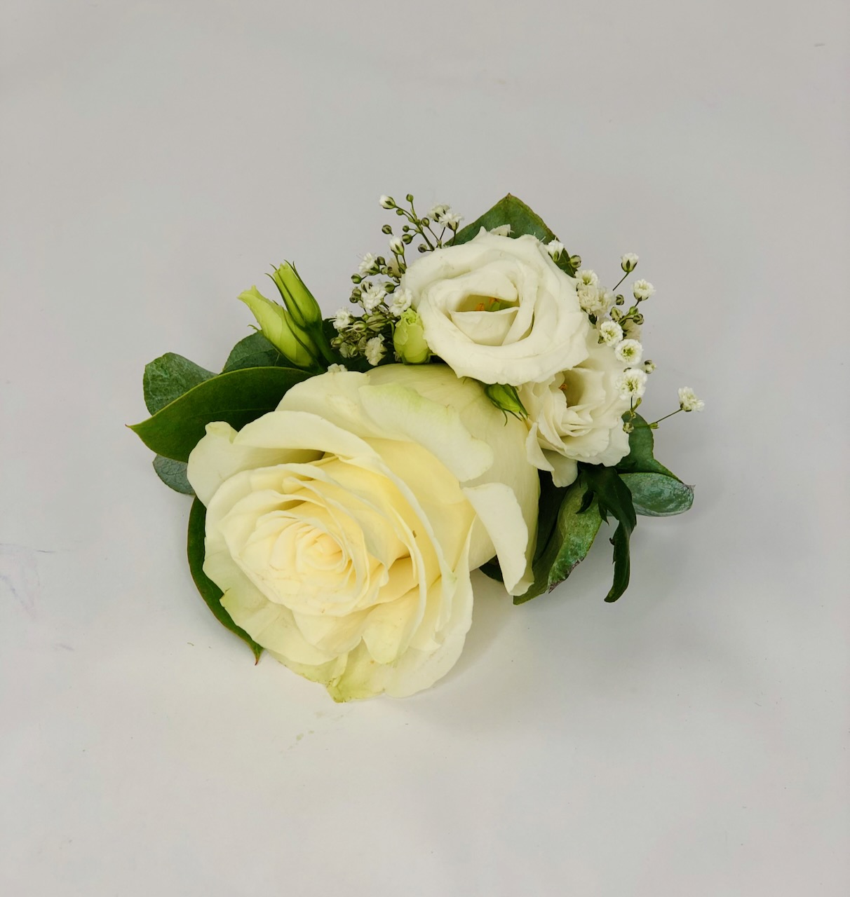White Rose and Lisianthus Grooms Buttonhole