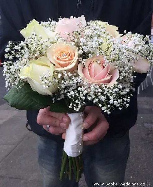bride handtied bouquet pink and peach roses with gypsophila and diamantes