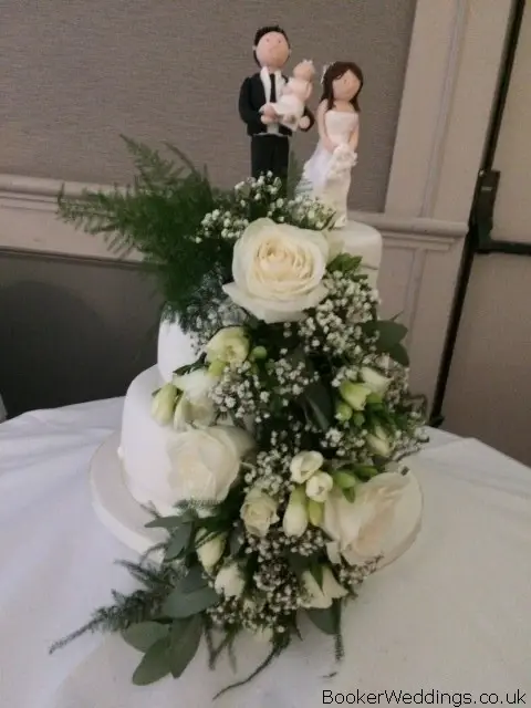 Wedding Cake Decorated with Roses and Freesias
