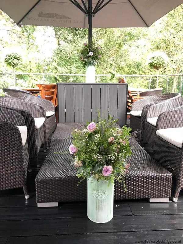 Tall Arrangements in Milk Churns for Rustic Wedding