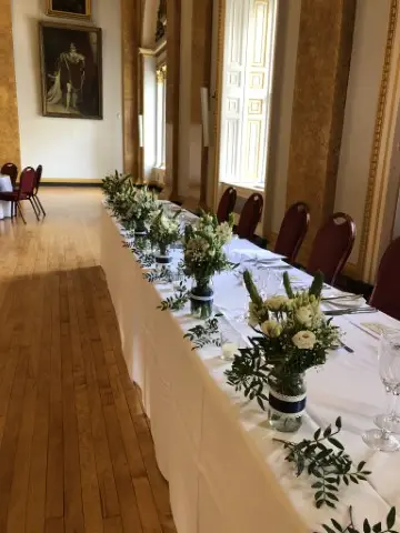 Top Table Flowers in Jars and Foliage