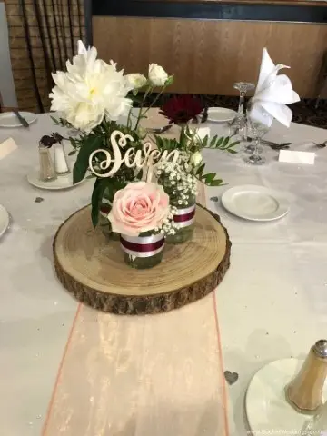 Small Table Centres of Roses and Peonies in Glass Jars