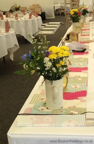 Just Picked Meadow Flowers Jug Table Centrepieces with Yellow Crysanthemums, White Aster Daisy and Blue Delphiniums at Speke Hall, Liverpool