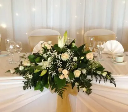 Peach Rose and Lily top table arrangement