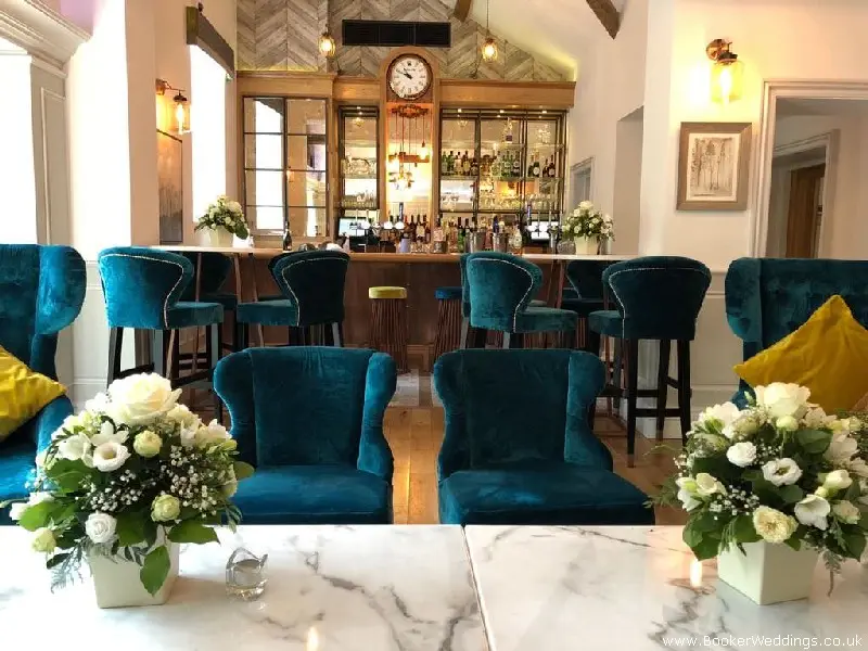Wedding Venue Table Arrangements of Roses and Freesias