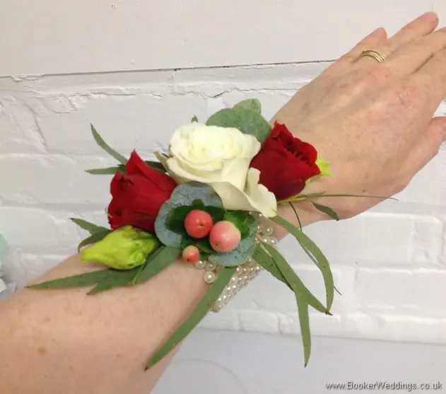 Wild Flower Wrist Corsage in Cream, Coral and Burgundy with Roses, Hypericum berries Lissianthus and Eucalyptus