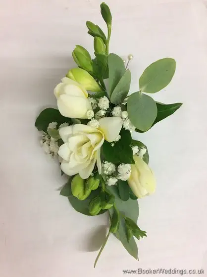 All white freesia and gypsophila pin corsage