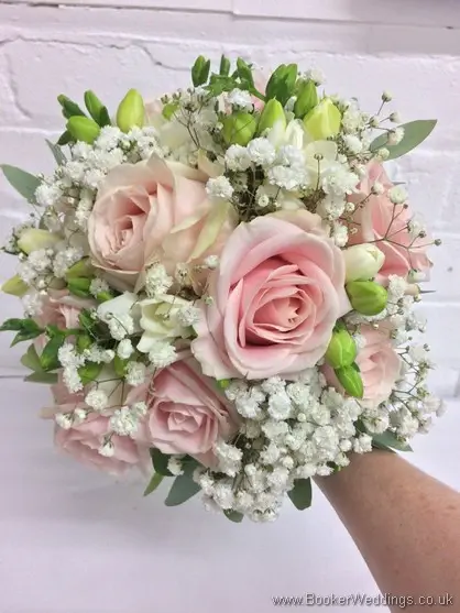 Soft pink and white bridal hand tied classic posy bouquet with roses, freesia and gypsy grass