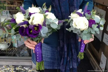 Purple and White Rose Freesia and Lissanthus Hand tied Bride and Bridesmaid bouquets