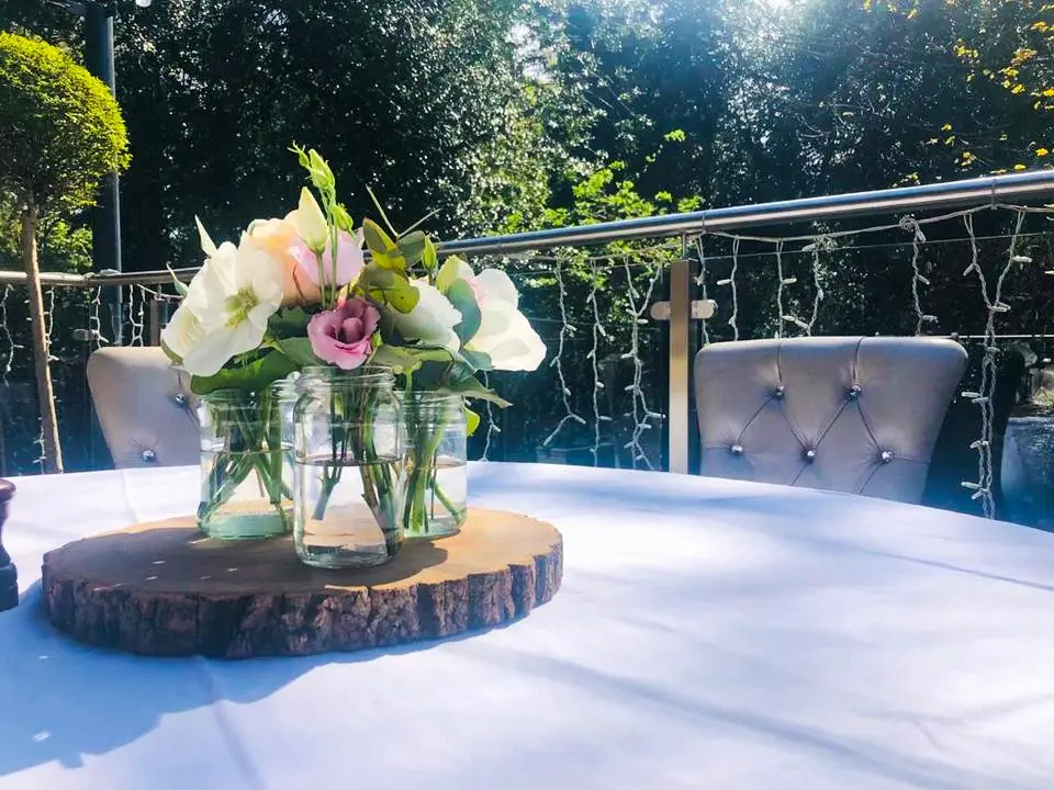 Flowers on Log Slices for Wedding Reception