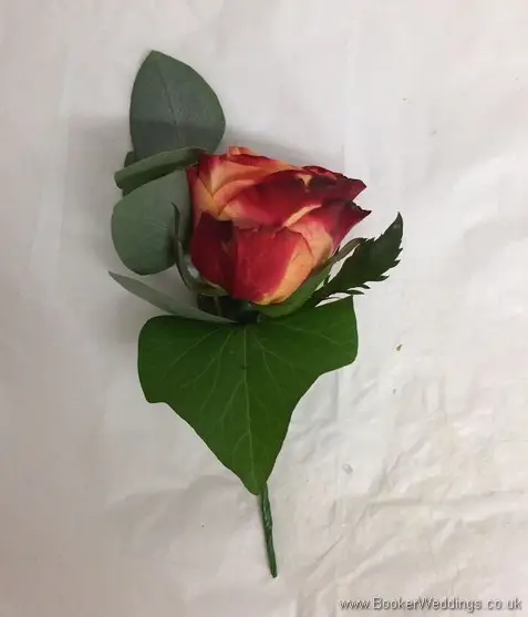 Orange rose and eucalyptus buttonhole side view