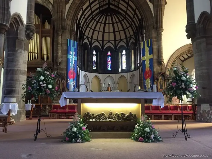 Wild just picked altar and pedestal flower arrangements at St Annes Church, Liverpool