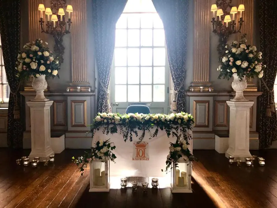 Registrar Table Flowers Lanterns and Pedestals