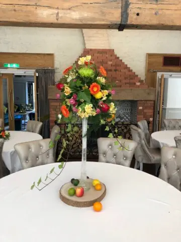 Tall Table Vase Of Gerbera Alstro Lissi And Blooms