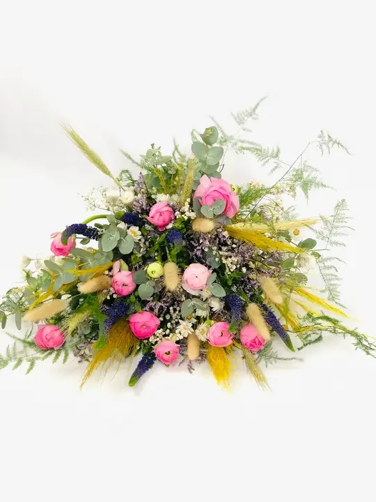 Bridal bouquet using fresh and dried flowers in bright colours