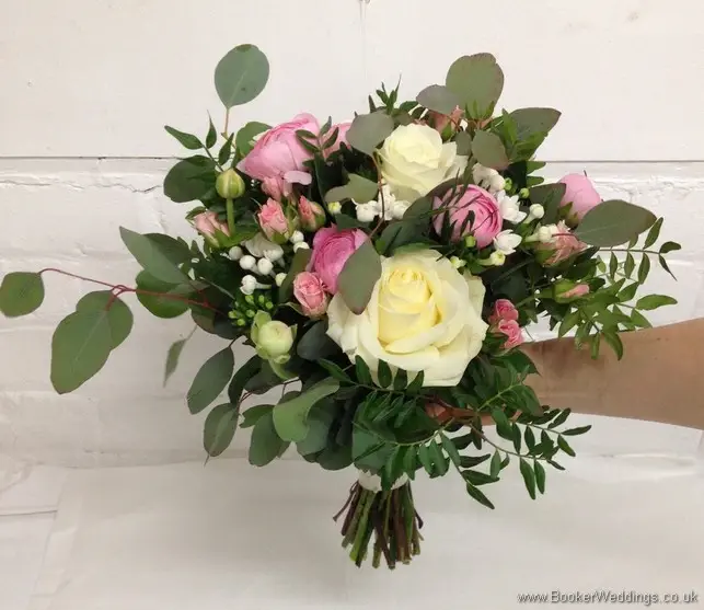 Semi-wild pale pink and cream with lots of textures & foliage Bridal Bouquet with roses, ranunculus, bouvardia, spray roses and eucalyptus Tilted View