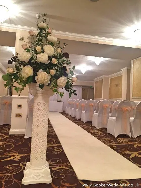 Pedestal Arrangement for Wedding Cemermony in Peaches and Cream
