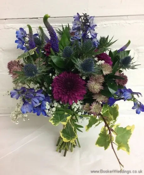Blue & purple wild, rustic, country style bridal bouquet with delphinium, crysanthemum blooms, eryngium, astrantia, veronica, gypsophila and ivy