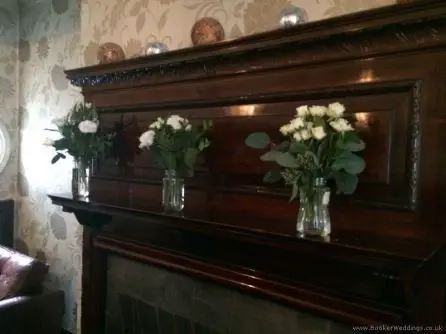 Ivory and Green Just Picked Jars of Flowers Mantlepiece Arrangements at Alicia Hotel