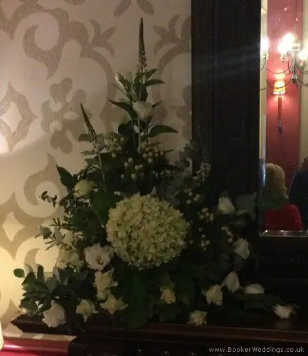 Ivory and Green Mantlepiece Arranagement at Alicia Hotel with Hydrangea, Spray Roses, Lissianthus, Hypericum, Burpurlum, Vibernum and Mixed Foliage