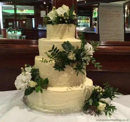 Ivory and Greenery Just Picked Cake Flowers with Spray Roses, Lissianthus, Hypericum, Hydrangea, Burpurlum, Vibernum and Mixed Foliage at the Alicia Hotel