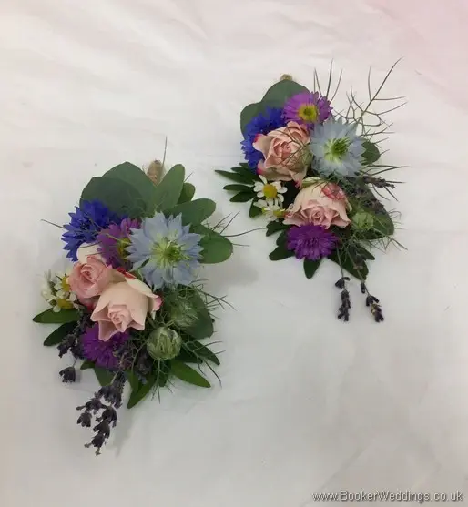 2 x pin corsages in a wild rustic just picked country style. Bright pinks, blues and purples wedding flower theme