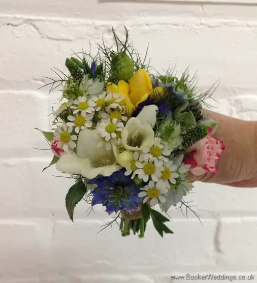 Mini just picked country style Flowergirl Hand Tied bouquet with Tanacetum, spray roses, freesia and nigela