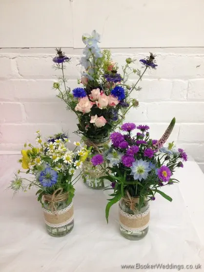 Table Centrepiece made up of 3 jam jars of just picked wild country style flowers