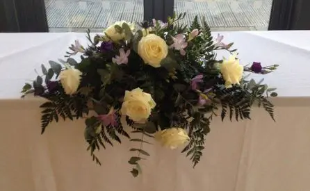 Rose Freesia, lissianthus and Eryngium Top Table arrangment 1
