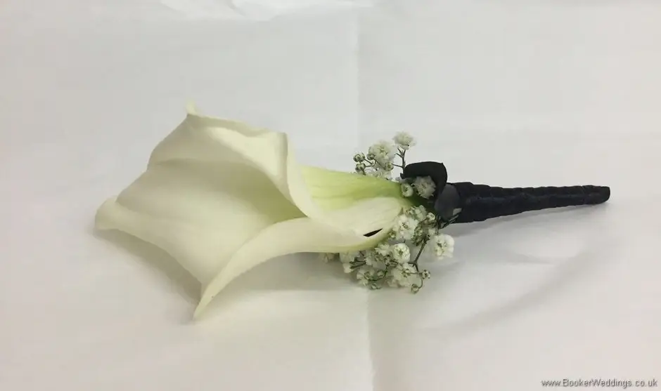 Ladies buttonhole of calla lily and sypsy grass