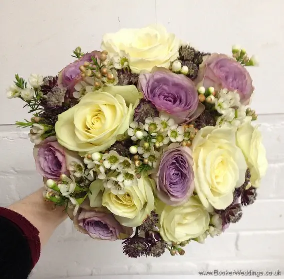 Ivory & Lilac Brides Hand Tied Bouquet with cream and lilac roses, wax flowers and astrantia