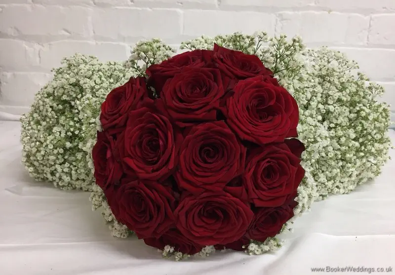 Bridal and Bridesmaid hand tied bouquets of red roses and gypsy grass