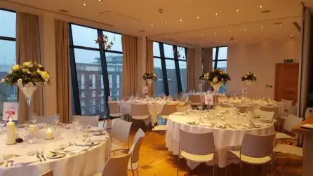 Martini Glass Table Centrepiece Arrangement White roses and Red Hypericum Room View