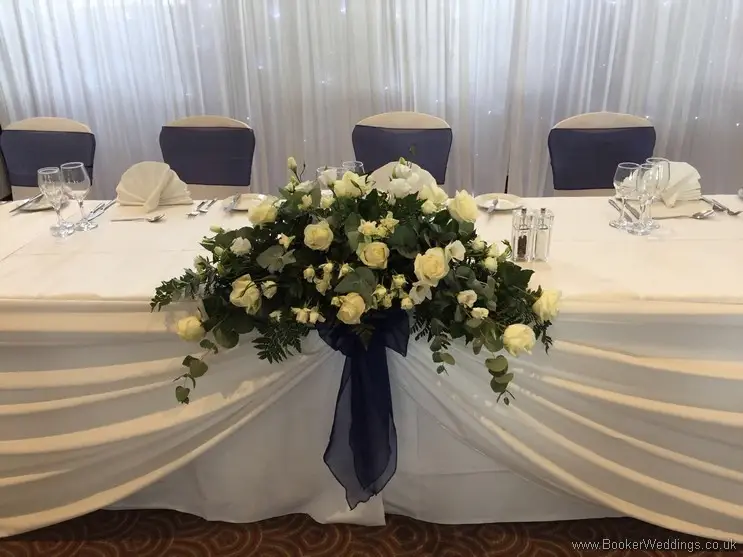 Top Table Arrangement with White Rose, Spray Rose, Eucalytus and Ruscus at Crowne Plaza Speke