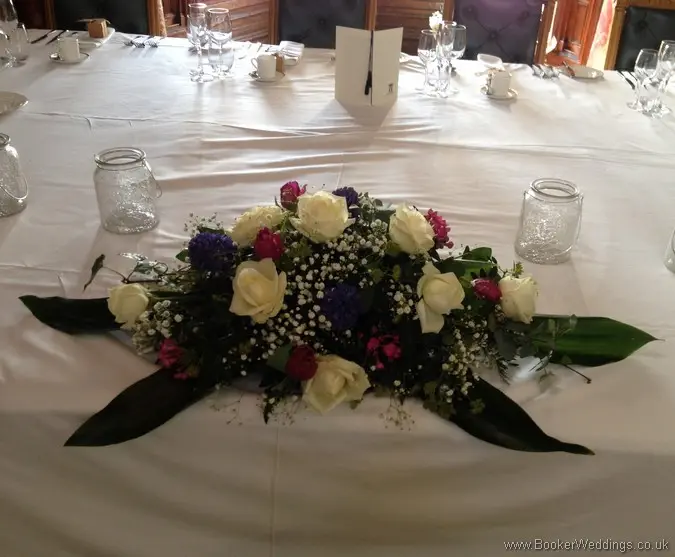 Long & Low Top Table Arrangement in Spring Mix Pinks Purples and Blues with Ivory rose, purple tulips, blue hyacinth, gypsy grass at Knowsley Hall