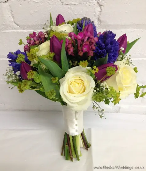 Spring Mix Pinks Purples and Blues Bridal Bouquet with Ivory rose, purple tulips, blue hyacinth, gypsy grass, pink bouvardia Side View