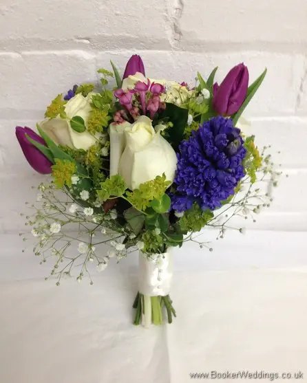 Spring Mix Pinks Purples and Blues Bridesmaid Bouquet with Ivory rose, purple tulips, blue hyacinth, gypsy grass, pink bouvardia Side View