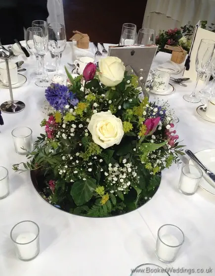 Spring Mix Pinks Purples and Blues Mirror Table Centrepiece with Ivory rose, purple tulips, blue hyacinth, gypsy grass, pink bouvardia
