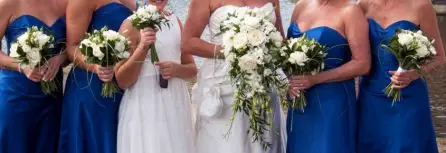 White Rose and Dendrobium Orchid Bride and Bridesmaid Bouquets