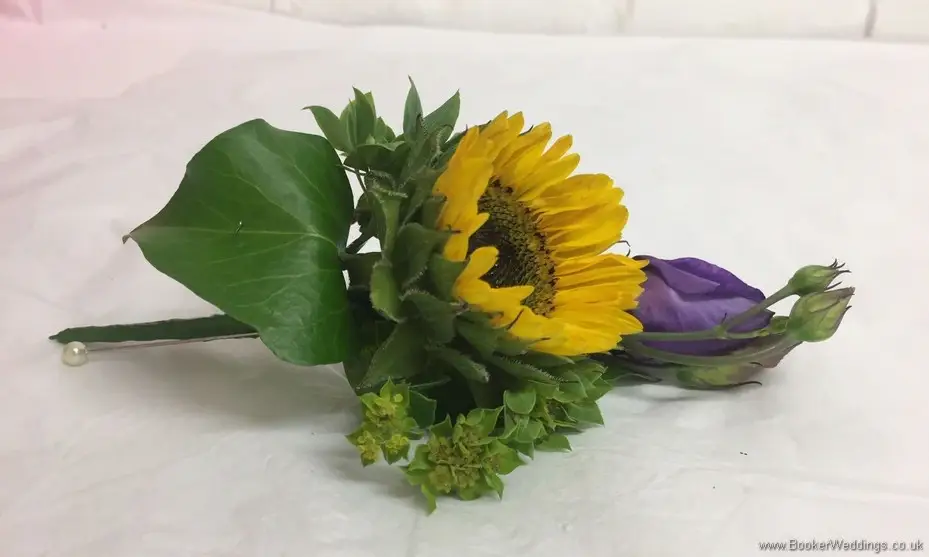 Grooms Buttonhole with Yellow Gerbera and purple lissianthus side view 2