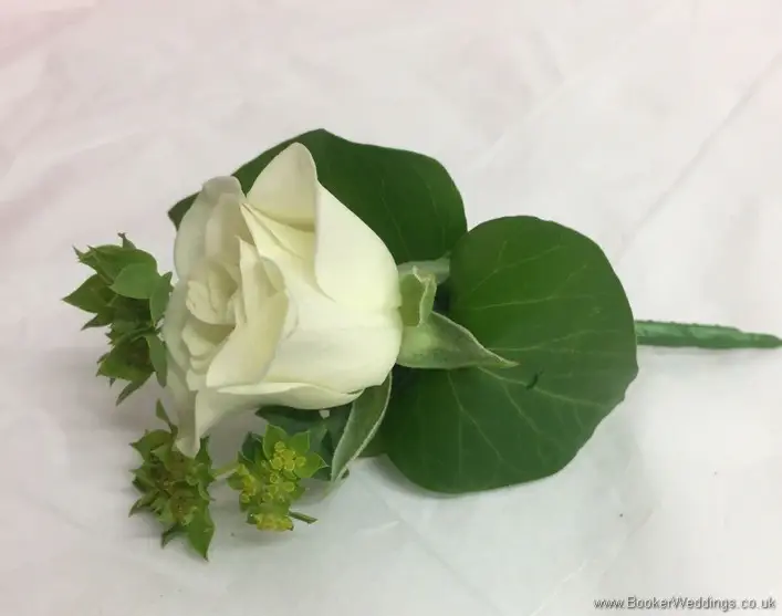 Page Boy white spray rose on badge fastening side view