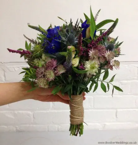 English Garden Just Picked Flowers Bridal Bouquet with Blue Delphinium, Eryngium, Heather, Astrantia, Purple Veronica & Nigella Side View